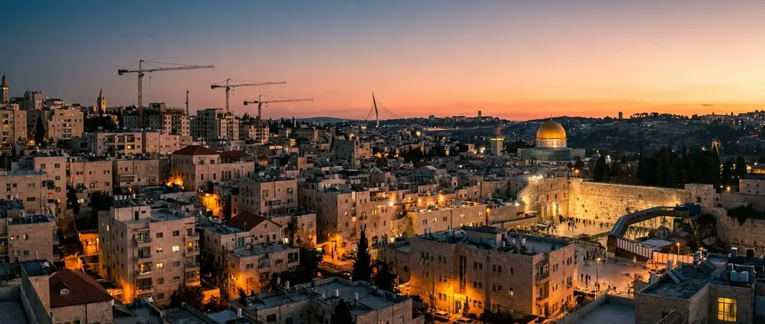 Illustration: Jerusalem rooftops and the Chords Bridge at dusk