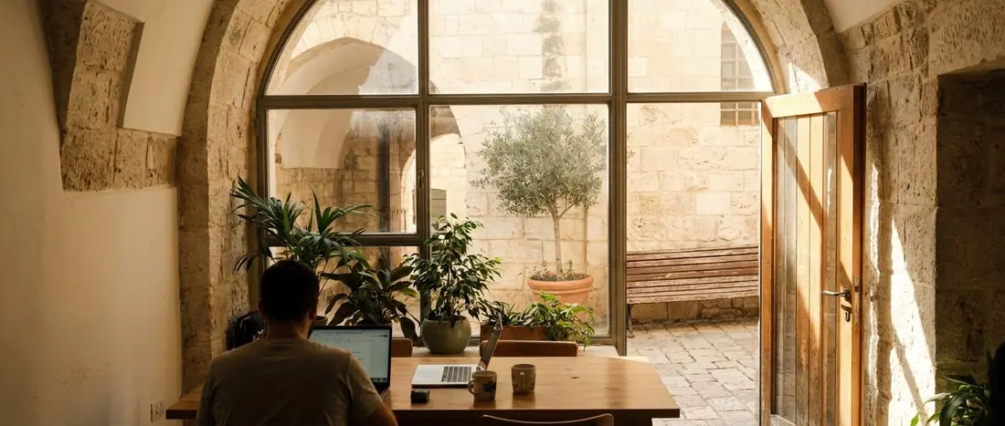 Illustration: the entrance of a small office in a Jerusalem stone building